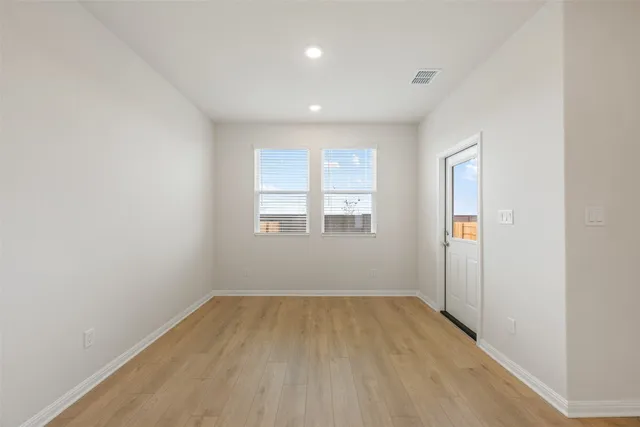 an empty room with windows