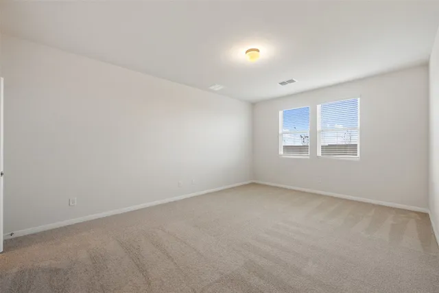 a bathroom with double sink and a mirror