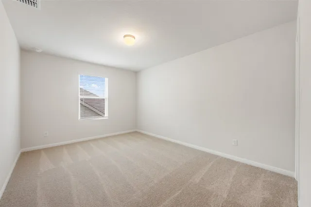 a bathroom with a toilet a sink a mirror a bathtub and vanity