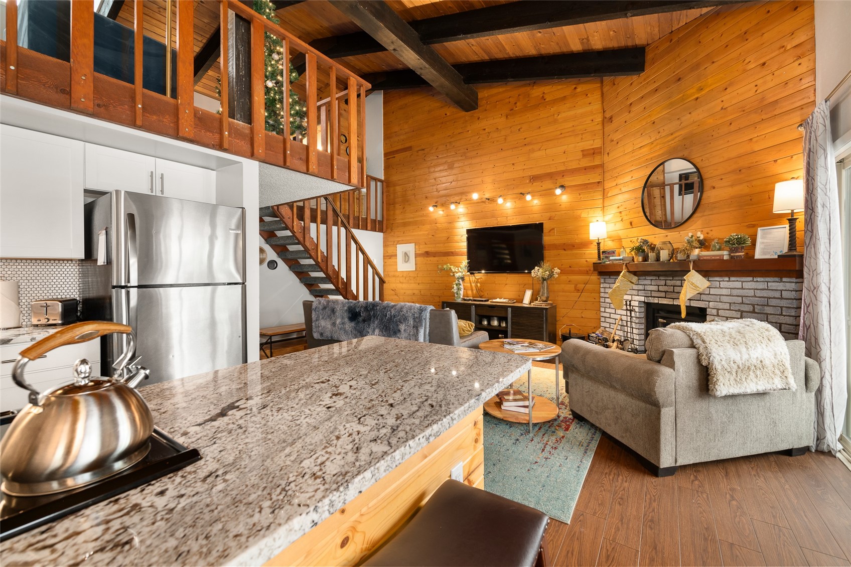 1335 Walton Creek Road, Unit 35 Steamboat Springs, CO 80487 - Photo 11 of 48 a living room with furniture and a fireplace