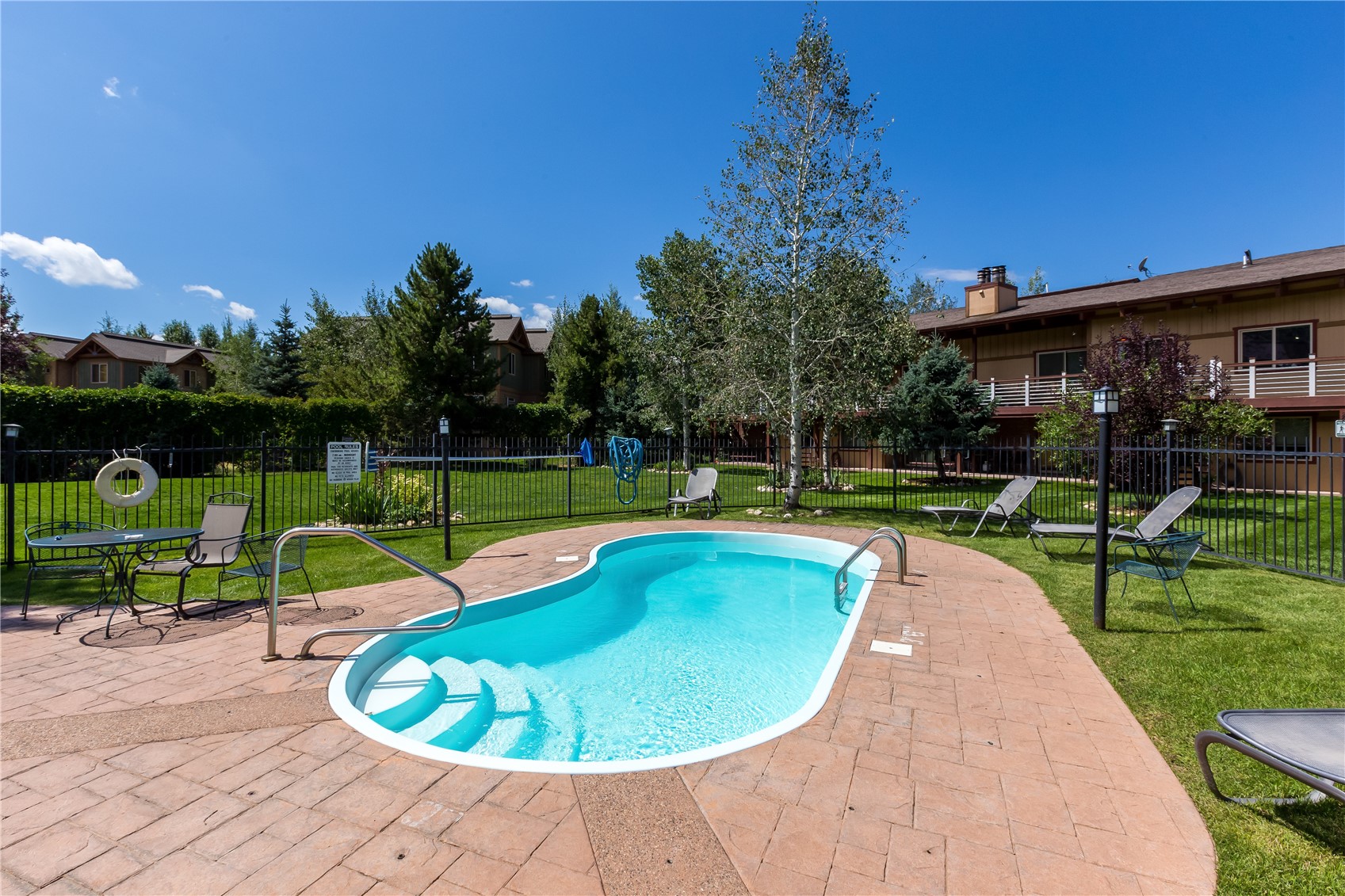 1335 Walton Creek Road, Unit 35 Steamboat Springs, CO 80487 - Photo 12 of 48 a view of a swimming pool with a garden