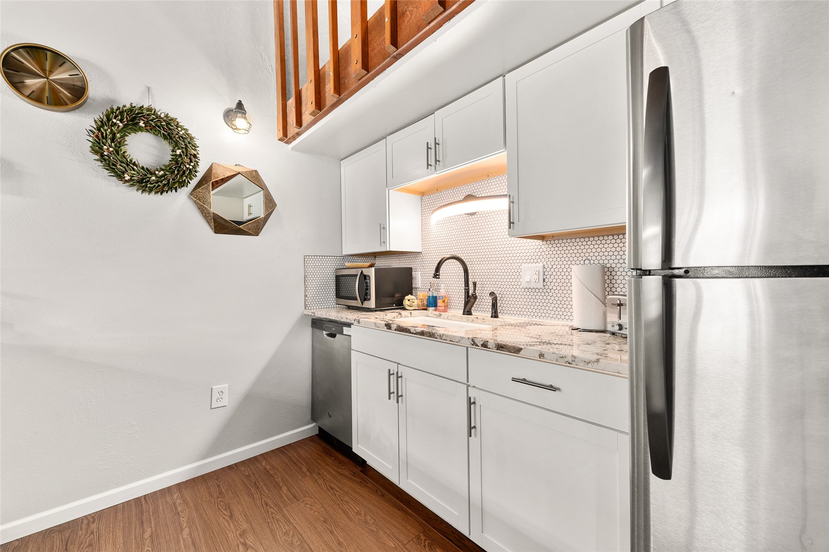 1335 Walton Creek Road, Unit 35 Steamboat Springs, CO 80487 - Photo 15 of 48 a kitchen with a sink and a refrigerator