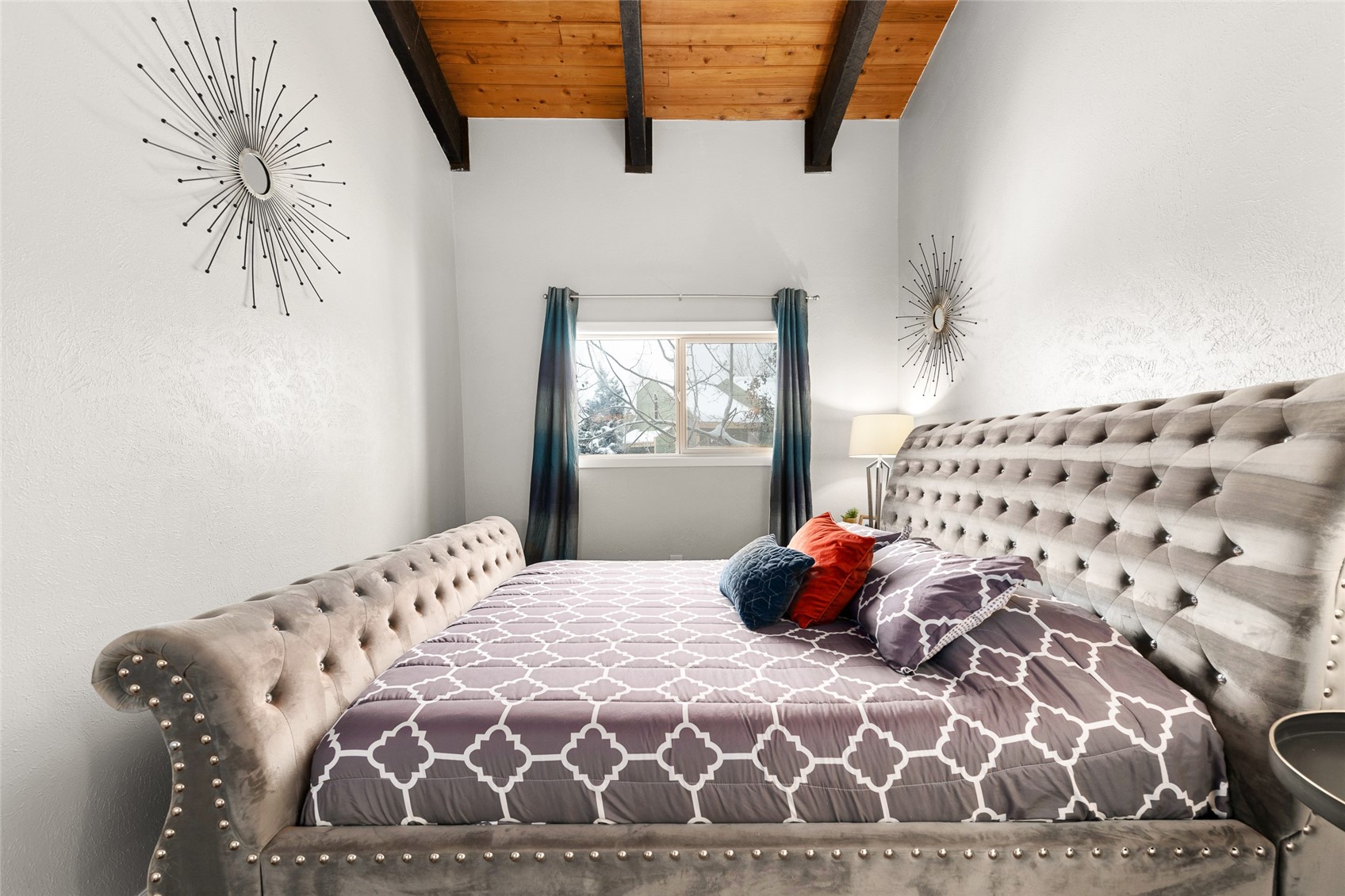 1335 Walton Creek Road, Unit 35 Steamboat Springs, CO 80487 - Photo 19 of 48 a bedroom with a bed and a window