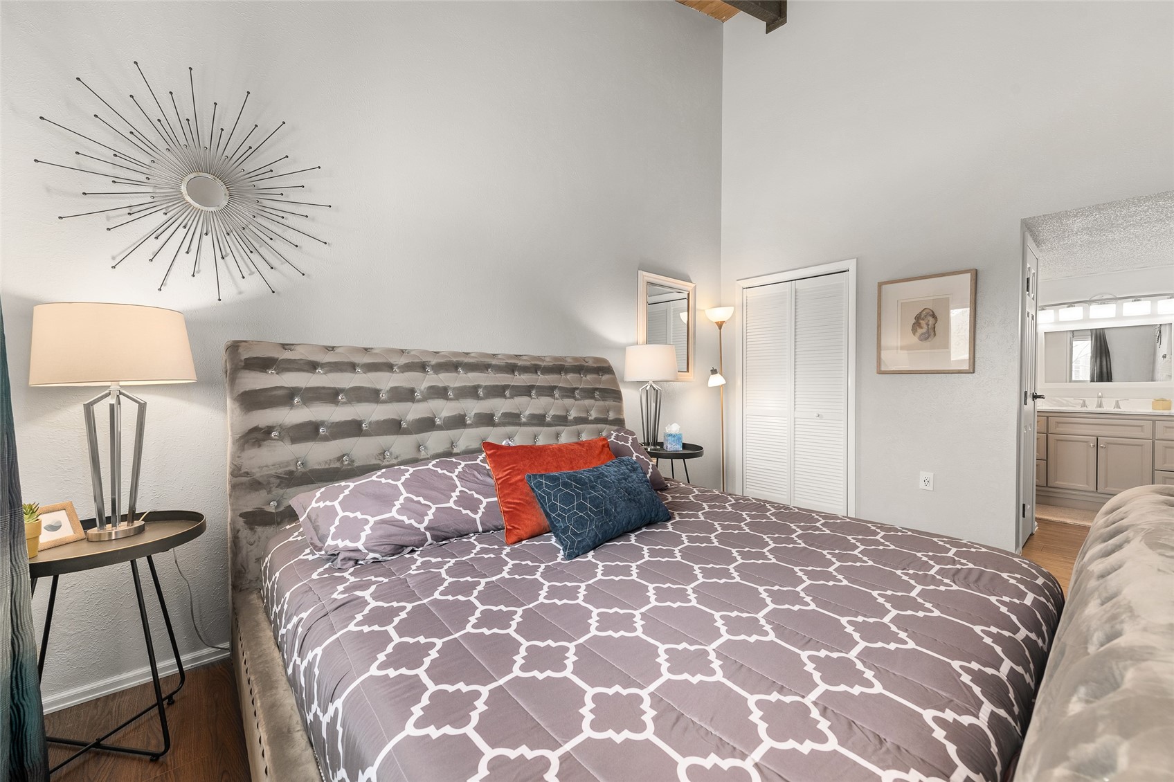 1335 Walton Creek Road, Unit 35 Steamboat Springs, CO 80487 - Photo 20 of 48 a bedroom with a large bed and a chandelier