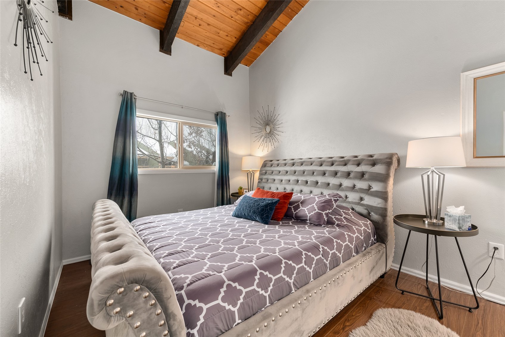 1335 Walton Creek Road, Unit 35 Steamboat Springs, CO 80487 - Photo 21 of 48 a bedroom with a large bed and a window