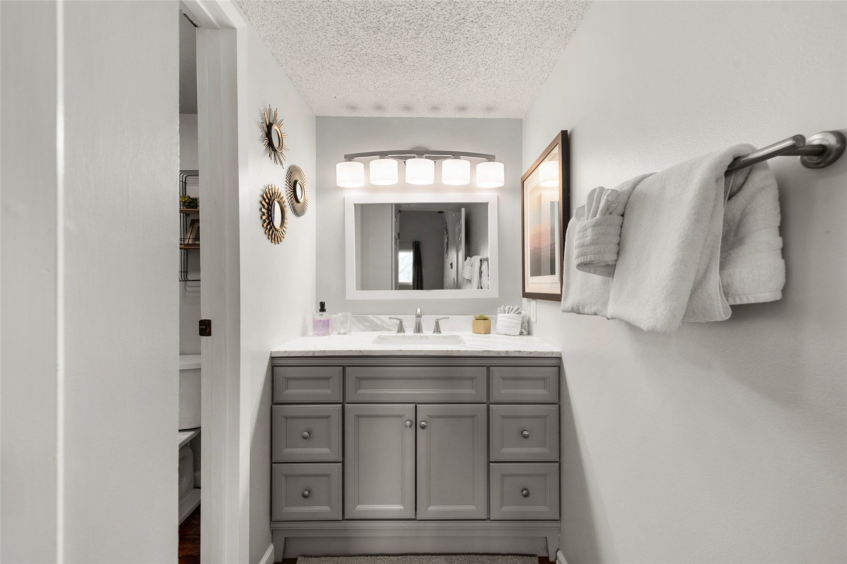 1335 Walton Creek Road, Unit 35 Steamboat Springs, CO 80487 - Photo 23 of 48 a bathroom with a granite countertop sink vanity and mirror
