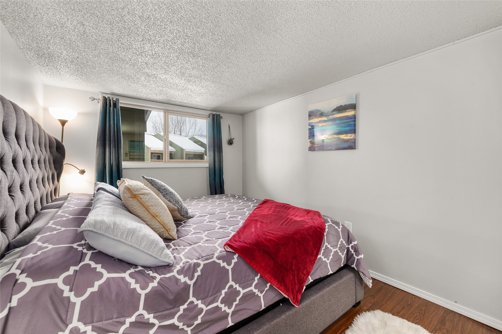 1335 Walton Creek Road, Unit 35 Steamboat Springs, CO 80487 - Photo 28 of 48 a bedroom with a bed and a window