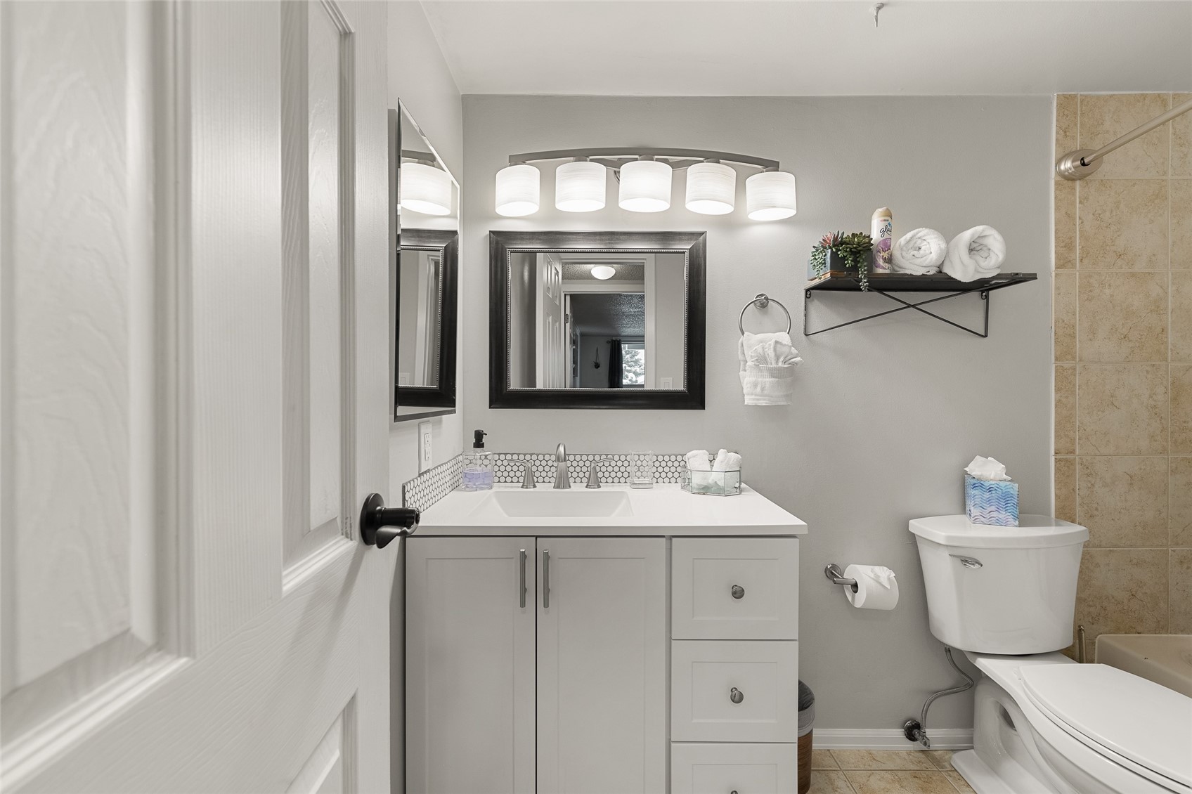 1335 Walton Creek Road, Unit 35 Steamboat Springs, CO 80487 - Photo 31 of 48 a bathroom with a toilet sink and mirror