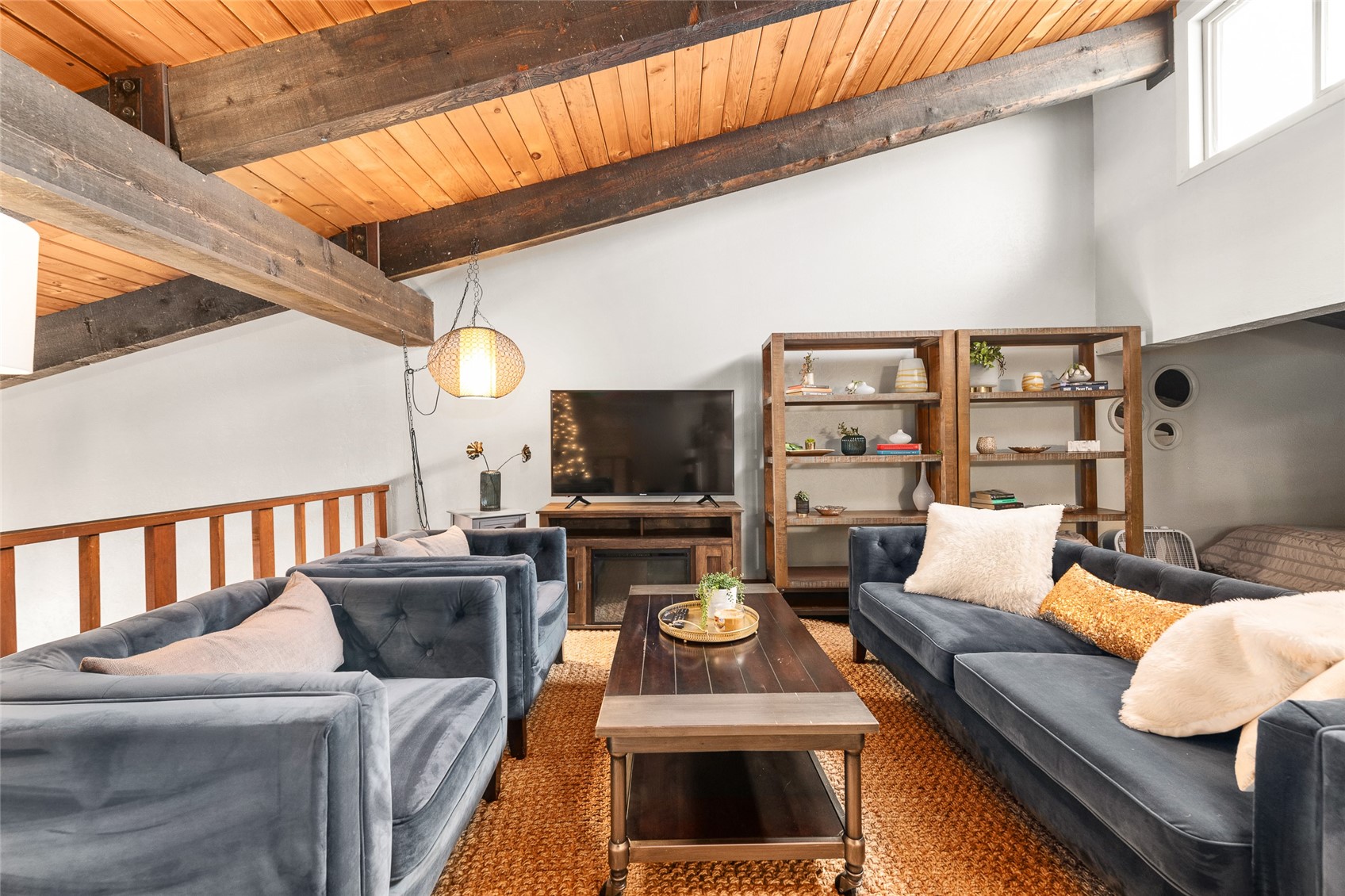 1335 Walton Creek Road, Unit 35 Steamboat Springs, CO 80487 - Photo 32 of 48 a living room with furniture and a flat screen tv