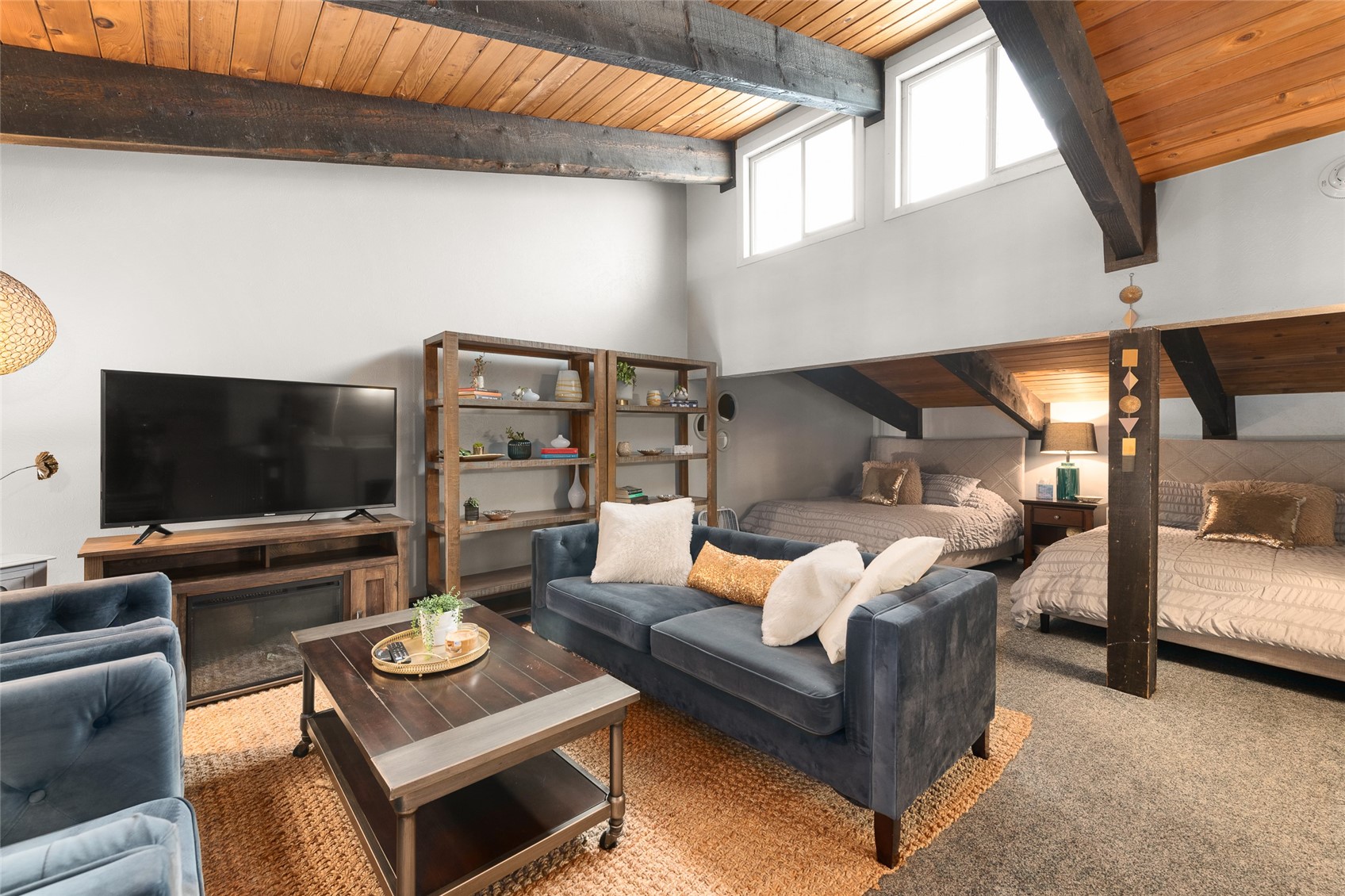 1335 Walton Creek Road, Unit 35 Steamboat Springs, CO 80487 - Photo 35 of 48 a outdoor living space with furniture and a flat screen tv