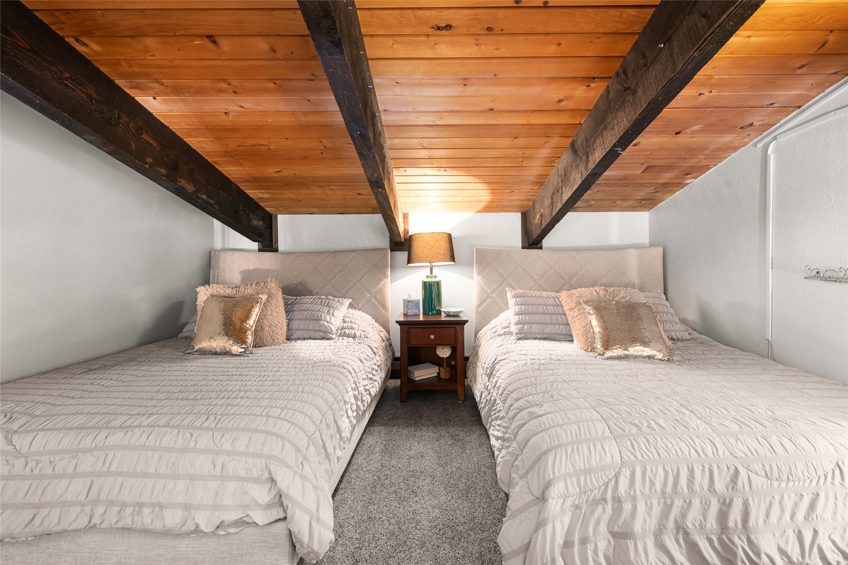 1335 Walton Creek Road, Unit 35 Steamboat Springs, CO 80487 - Photo 38 of 48 a bedroom with two beds and window