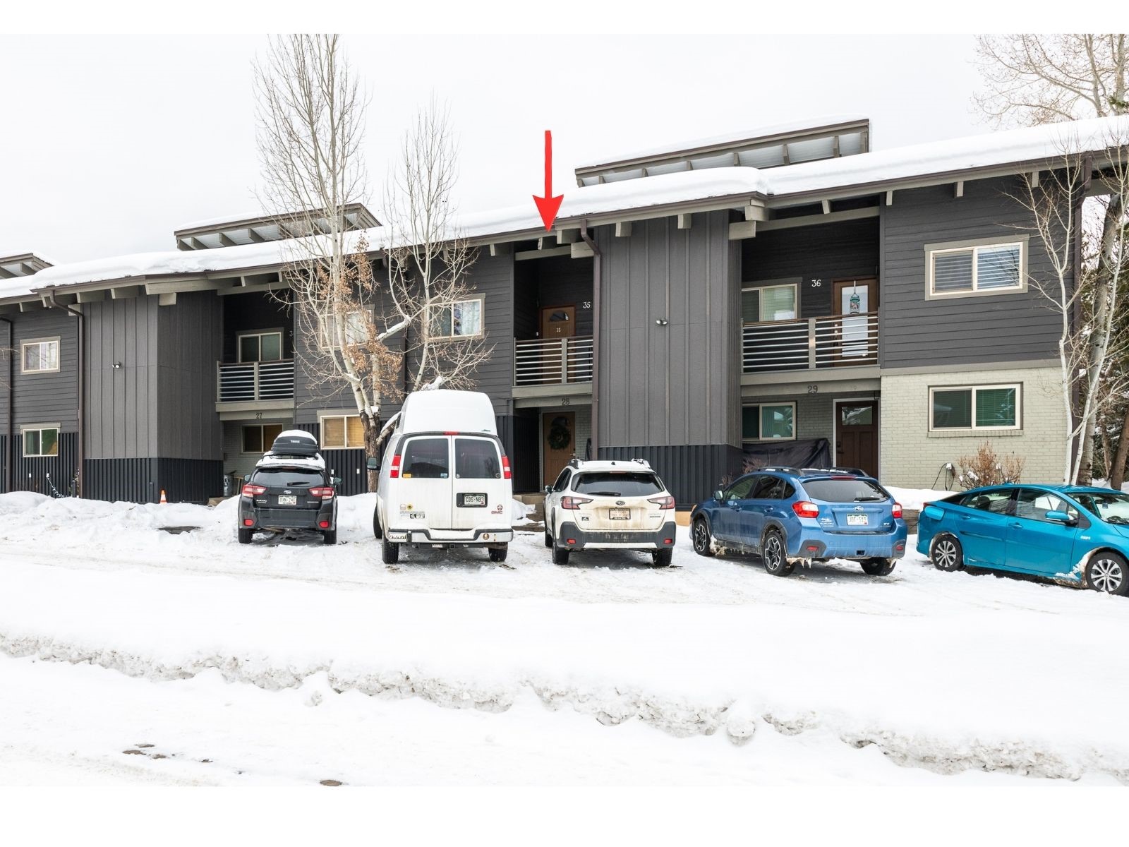 1335 Walton Creek Road, Unit 35 Steamboat Springs, CO 80487 - Photo 44 of 48 a view of a car park in front of house