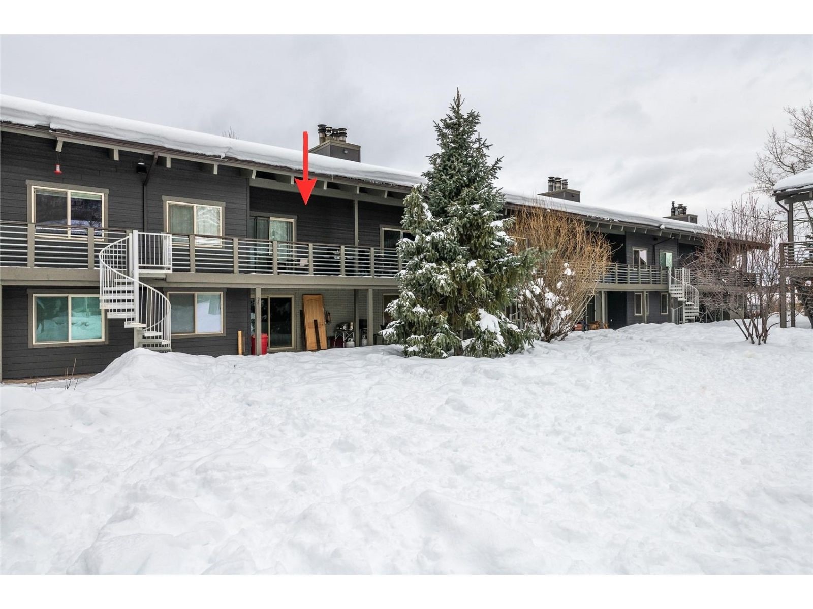 1335 Walton Creek Road, Unit 35 Steamboat Springs, CO 80487 - Photo 46 of 48 a front view of a house with a yard