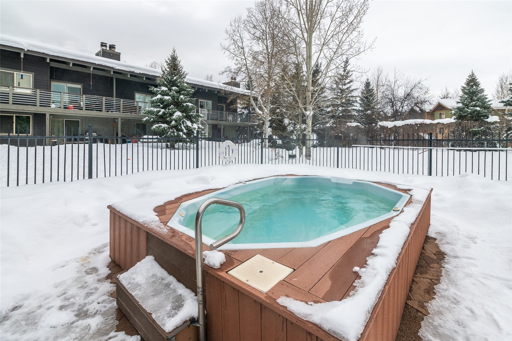 1335 Walton Creek Road, Unit 35 Steamboat Springs, CO 80487 - Photo 5 of 48 a view of a wooden deck and a backyard