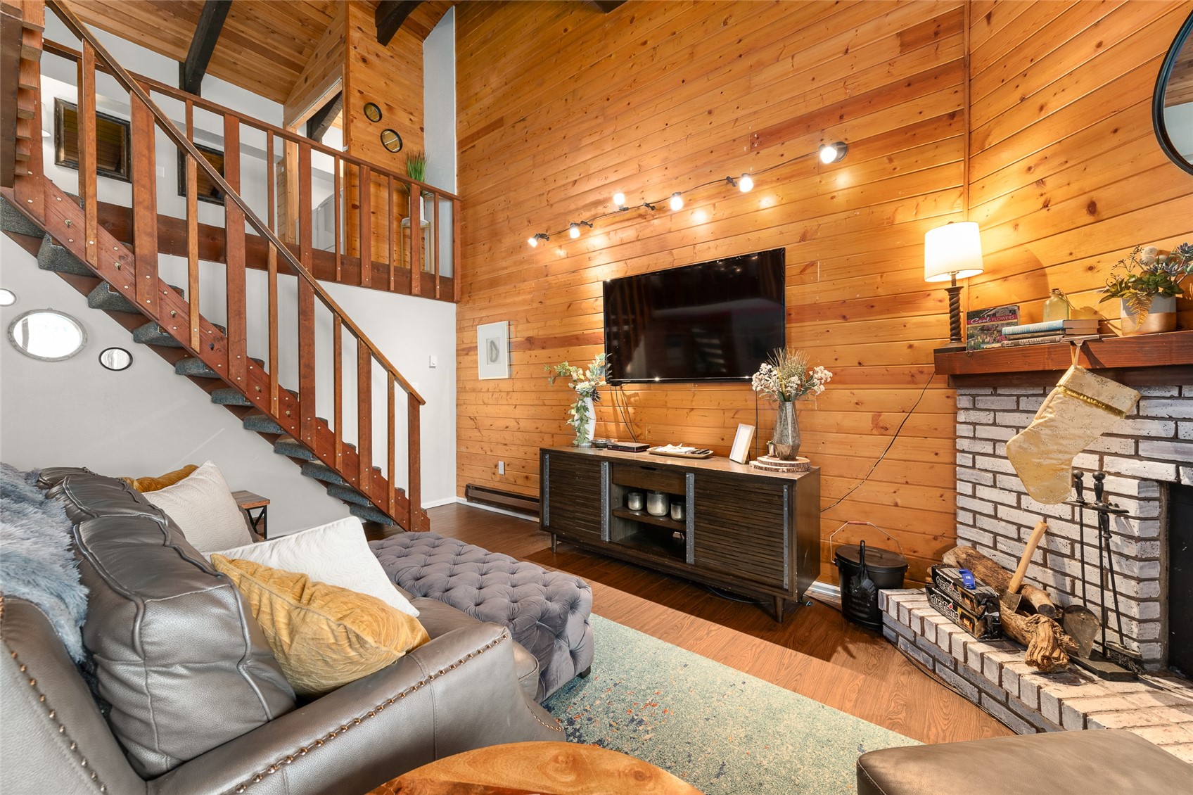 1335 Walton Creek Road, Unit 35 Steamboat Springs, CO 80487 - Photo 8 of 48 a living room with couches a flat screen tv and kitchen view