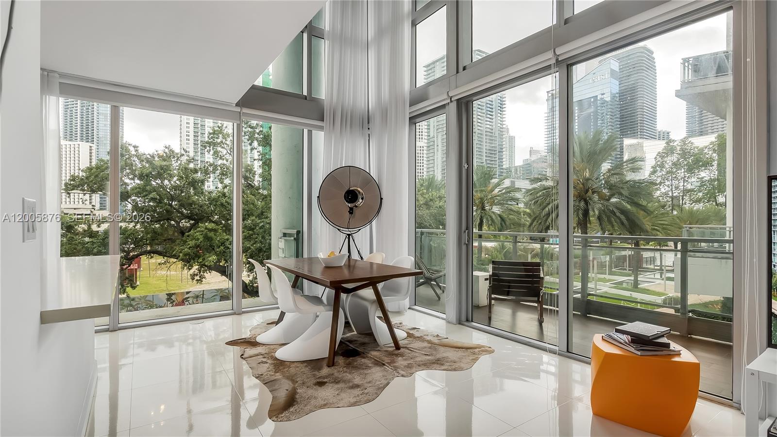 90 Southwest 3rd Street, Unit TH 308 Miami, FL 33130 - Photo 1 of 28 a living room with furniture and a large window