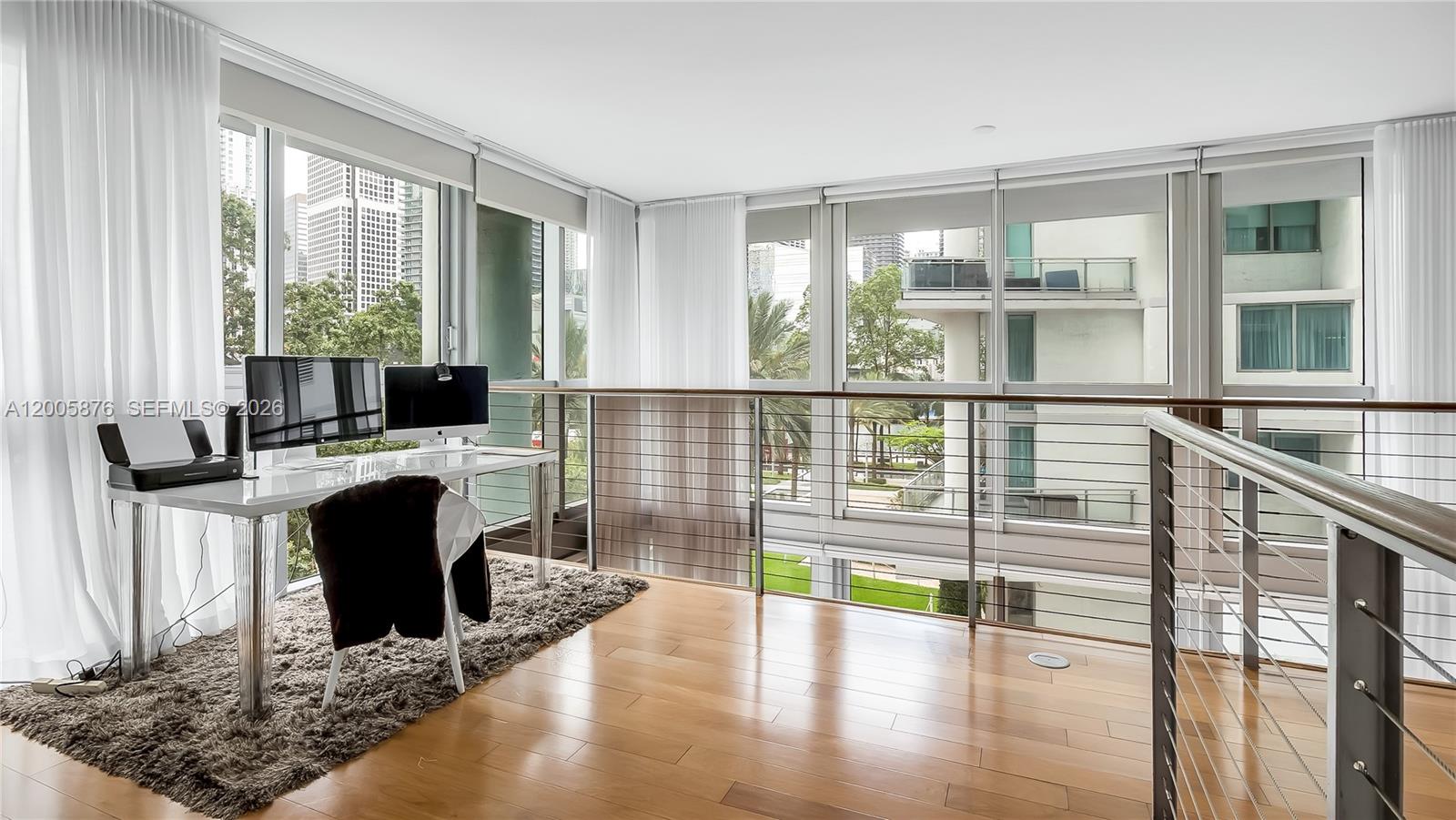 90 Southwest 3rd Street, Unit TH 308 Miami, FL 33130 - Photo 16 of 28 a view of a living room and floor to ceiling window