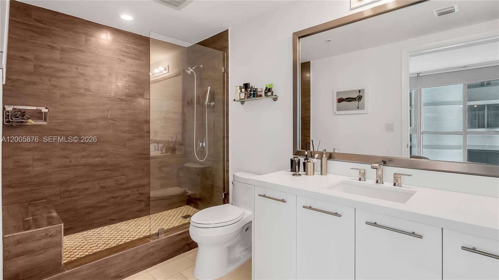 90 Southwest 3rd Street, Unit TH 308 Miami, FL 33130 - Photo 20 of 28 a bathroom with a sink a toilet and shower
