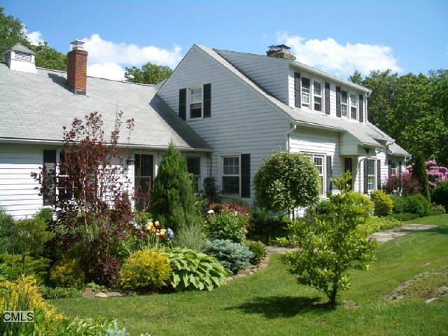 189 Cornwall Road Warren, CT 06754 - Photo 1 of 1 a front view of a house with a yard