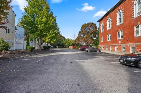 a view of street with parked cars