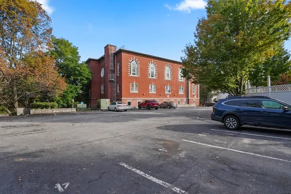 a view of a car parked in front of a house