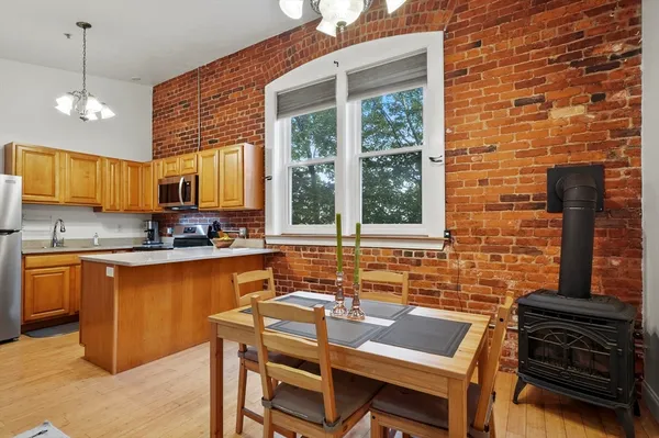 a kitchen with a sink cabinets and window