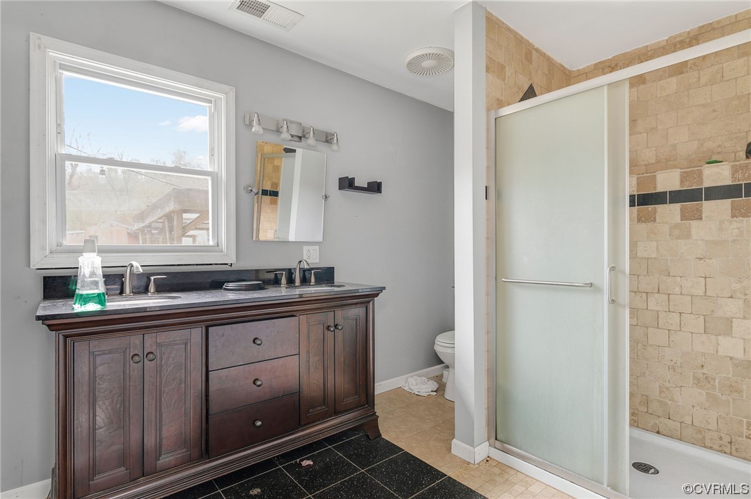 2949 Broadstreet Road Gum Spring, VA 23065 - Photo 13 of 21 a view of a bathroom with a sink mirror and a shower