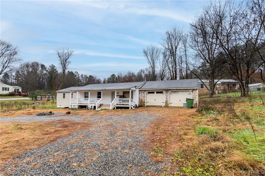 2949 Broadstreet Road Gum Spring, VA 23065 - Photo 3 of 21 a view of a house with a big yard and large trees