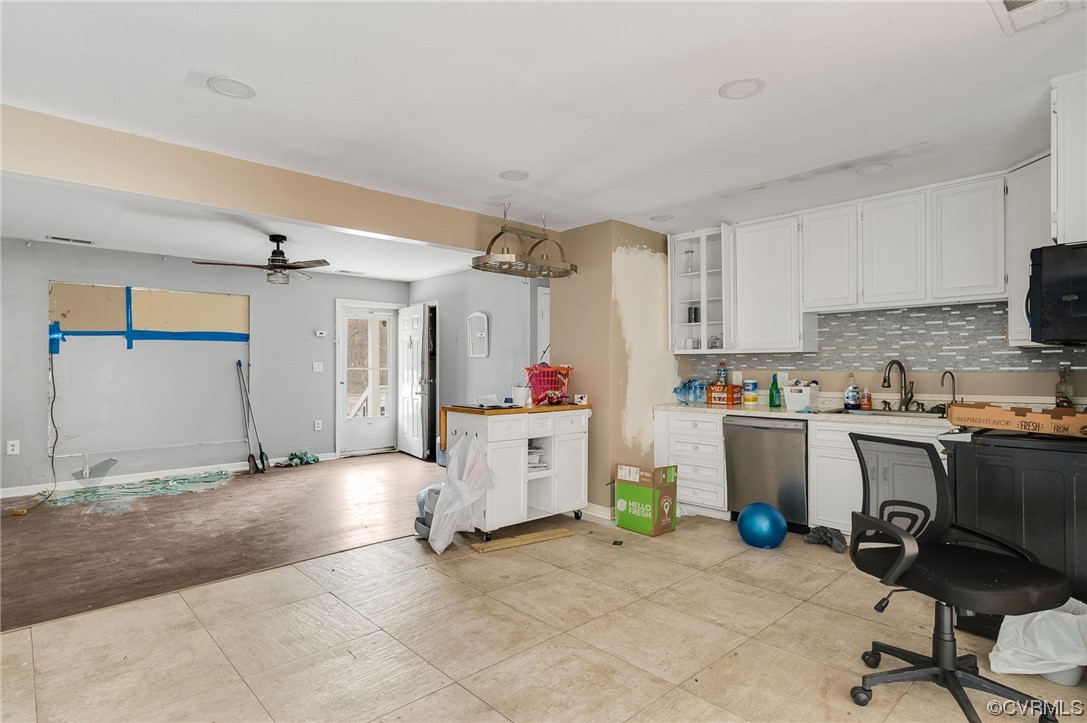 2949 Broadstreet Road Gum Spring, VA 23065 - Photo 7 of 21 a kitchen with a refrigerator and white cabinets