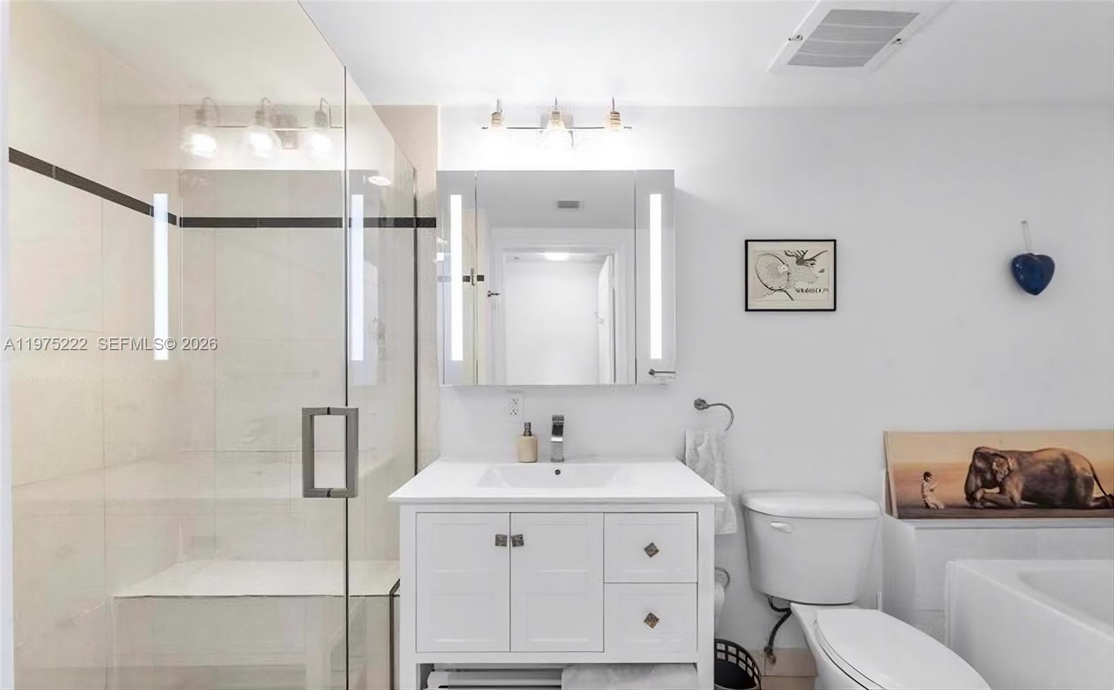 480 Northeast 30th Street, Unit 1607 Miami, FL 33137 - Photo 16 of 25 Primary Bathroom with separate shower and bathtub