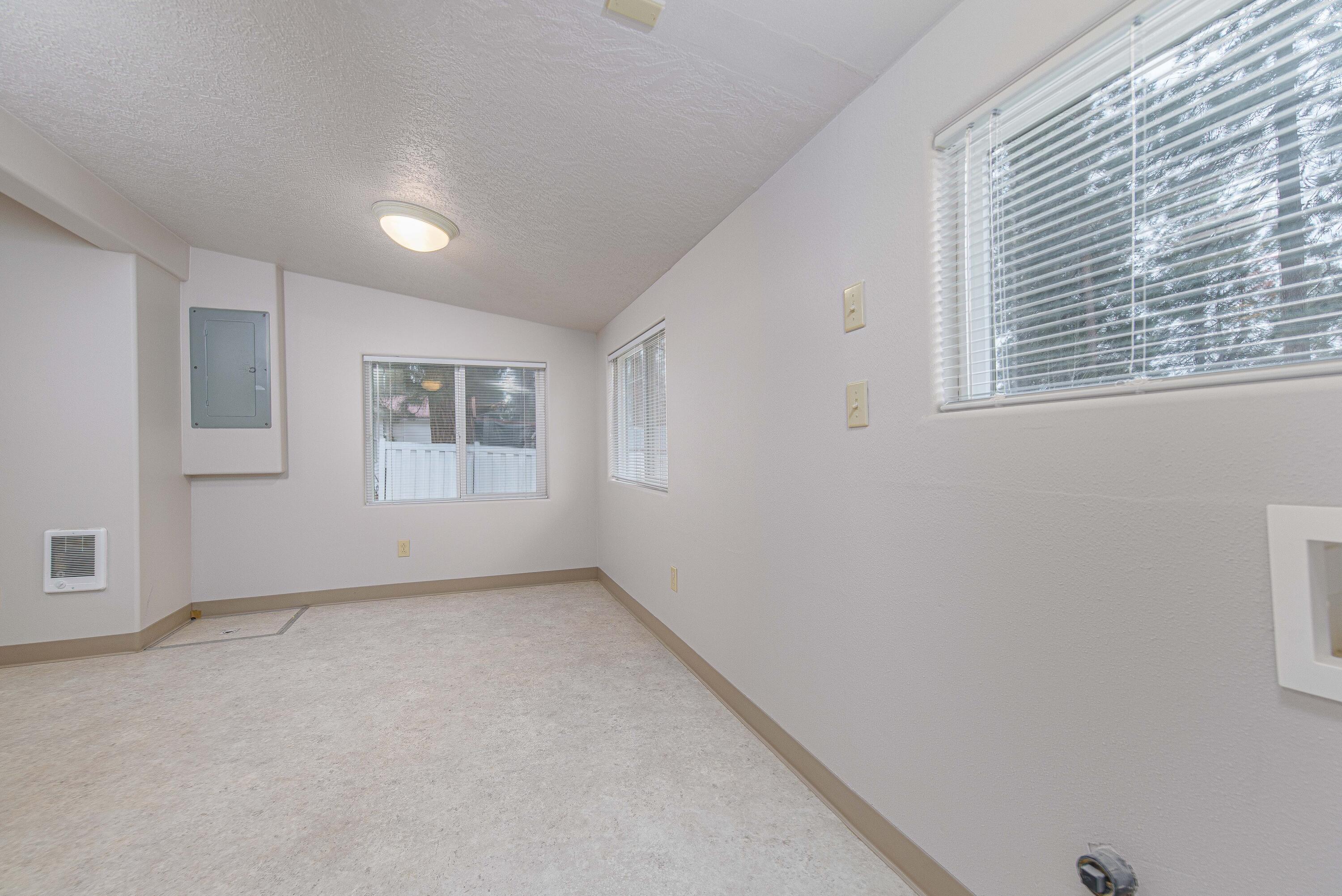 138722 Rhododendron Street Gilchrist, OR 97737 - Photo 20 of 36 a view of an empty room with windows