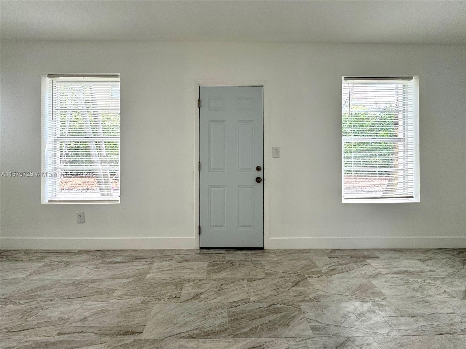 6955 Rue Vendome, Unit 2 Miami Beach, FL 33141 - Photo 3 of 21 a view of an empty room with a window