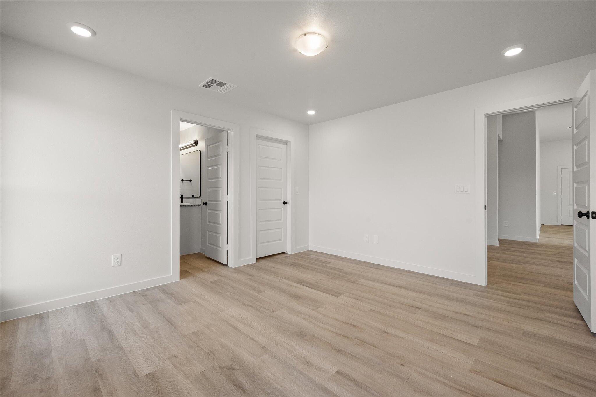 6308 Virginia Avenue Lubbock, TX 79407 - Photo 12 of 20 a view of empty room with wooden floor