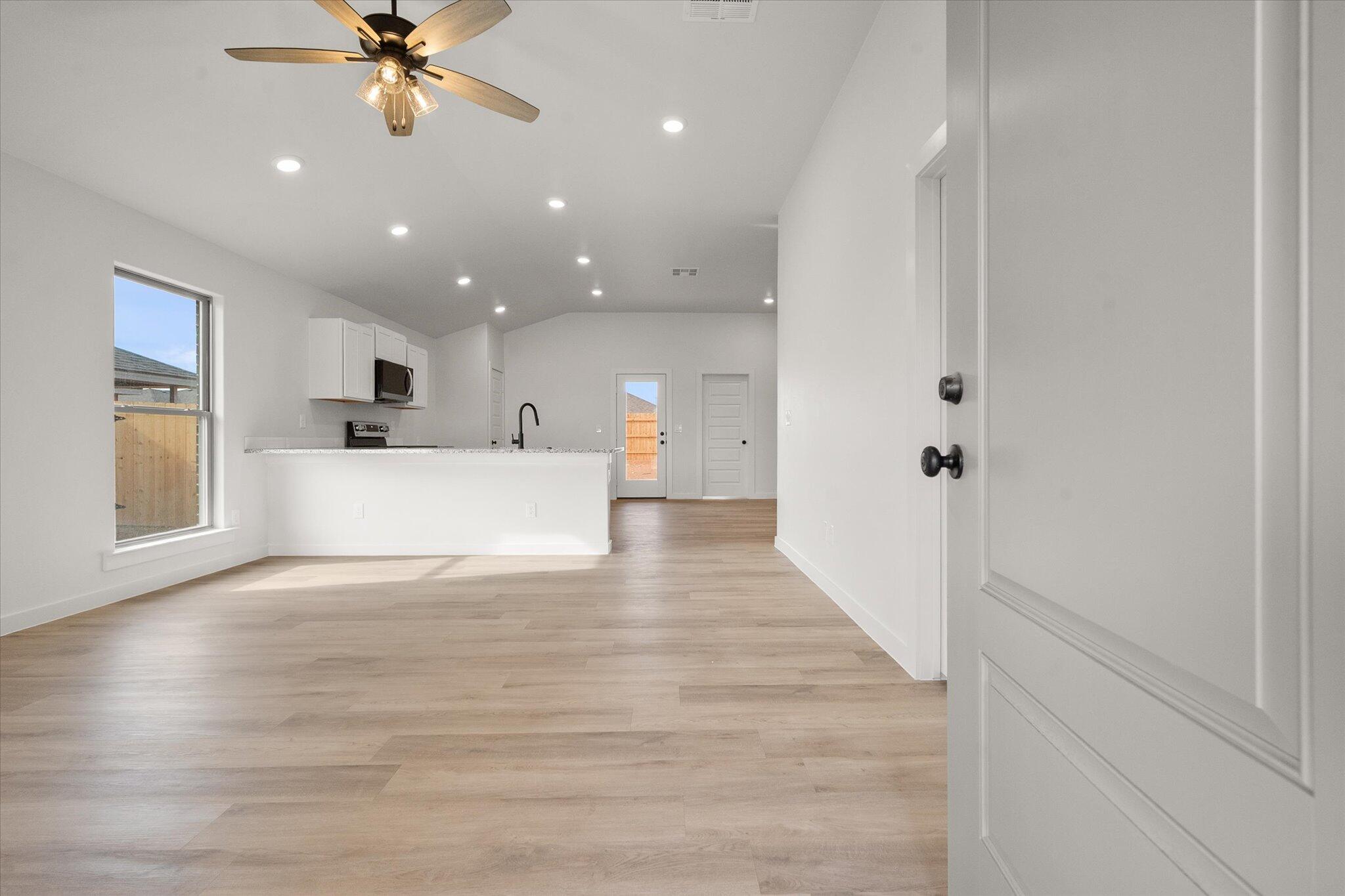 6308 Virginia Avenue Lubbock, TX 79407 - Photo 2 of 20 a view of a kitchen with a sink and a window