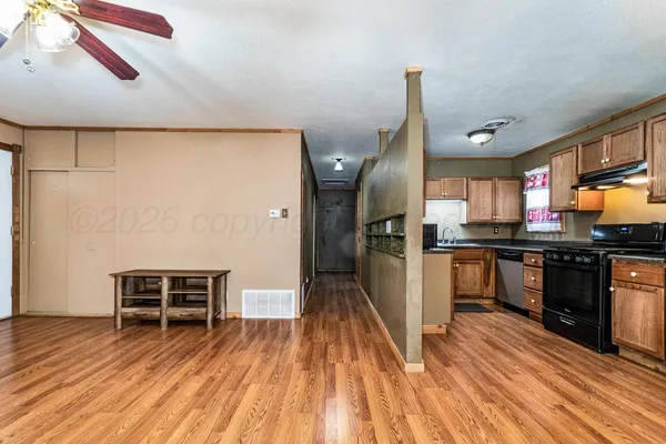 a view of an empty room with a window