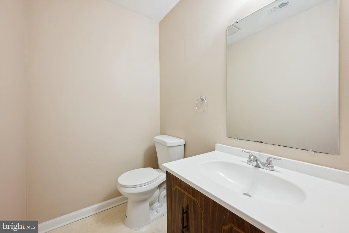 8 Tulip Court Mount Laurel, NJ 08054 - Photo 13 of 23 a bathroom with a sink a toilet and a mirror