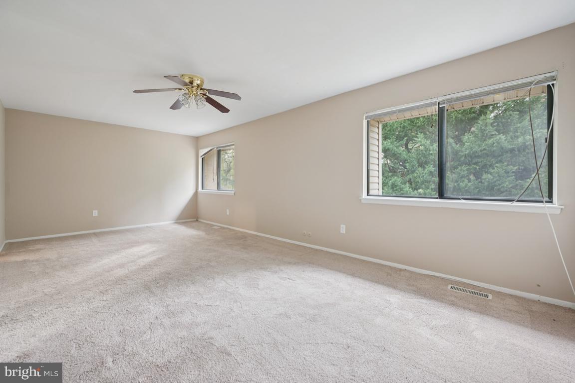 8 Tulip Court Mount Laurel, NJ 08054 - Photo 14 of 23 a view of room with a ceiling fan and window