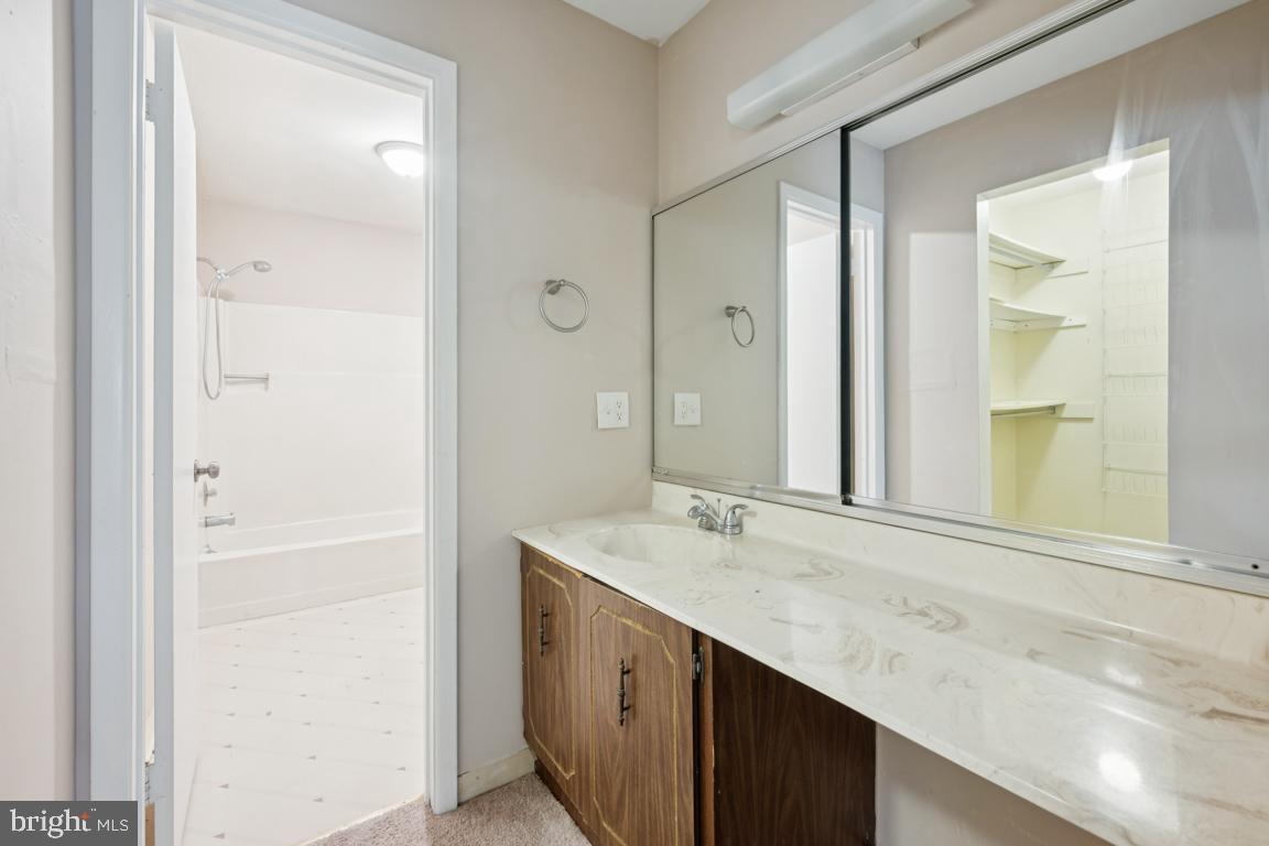 8 Tulip Court Mount Laurel, NJ 08054 - Photo 16 of 23 a bathroom with a sink a mirror and a shower