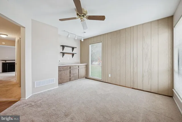 a view of a kitchen with a sink and cabinet area