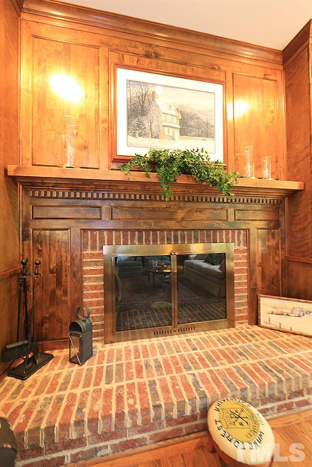 14408 Possum Track Road Raleigh, NC 27614 - Photo 6 of 25 Beautiful wood mantel surrounds raised hearth fireplace