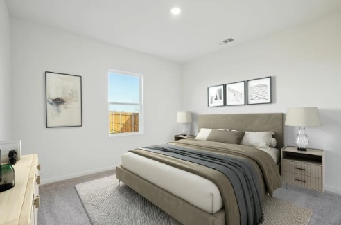 16041 Cowslip Way Austin, TX 78725 - Photo 18 of 26 a bedroom with a bed and a window