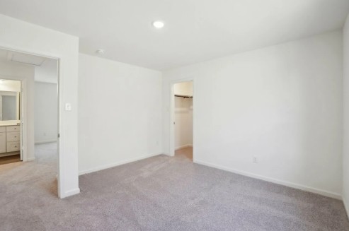 16041 Cowslip Way Austin, TX 78725 - Photo 21 of 26 an empty room with an entryway