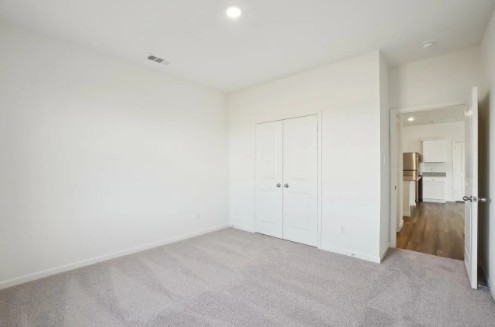 16041 Cowslip Way Austin, TX 78725 - Photo 23 of 26 a view of a livingroom and a hallway