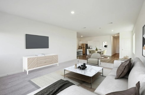 16041 Cowslip Way Austin, TX 78725 - Photo 9 of 26 a living room with furniture a rug and a flat screen tv