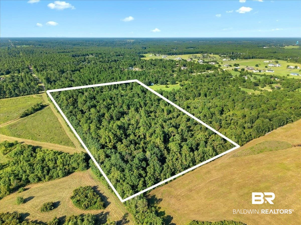 0 Stucki Road Elberta, AL 36530 - Photo 6 of 15 Aerial view of property and surrounding area featuring a heavily wooded area and property parcel outlined