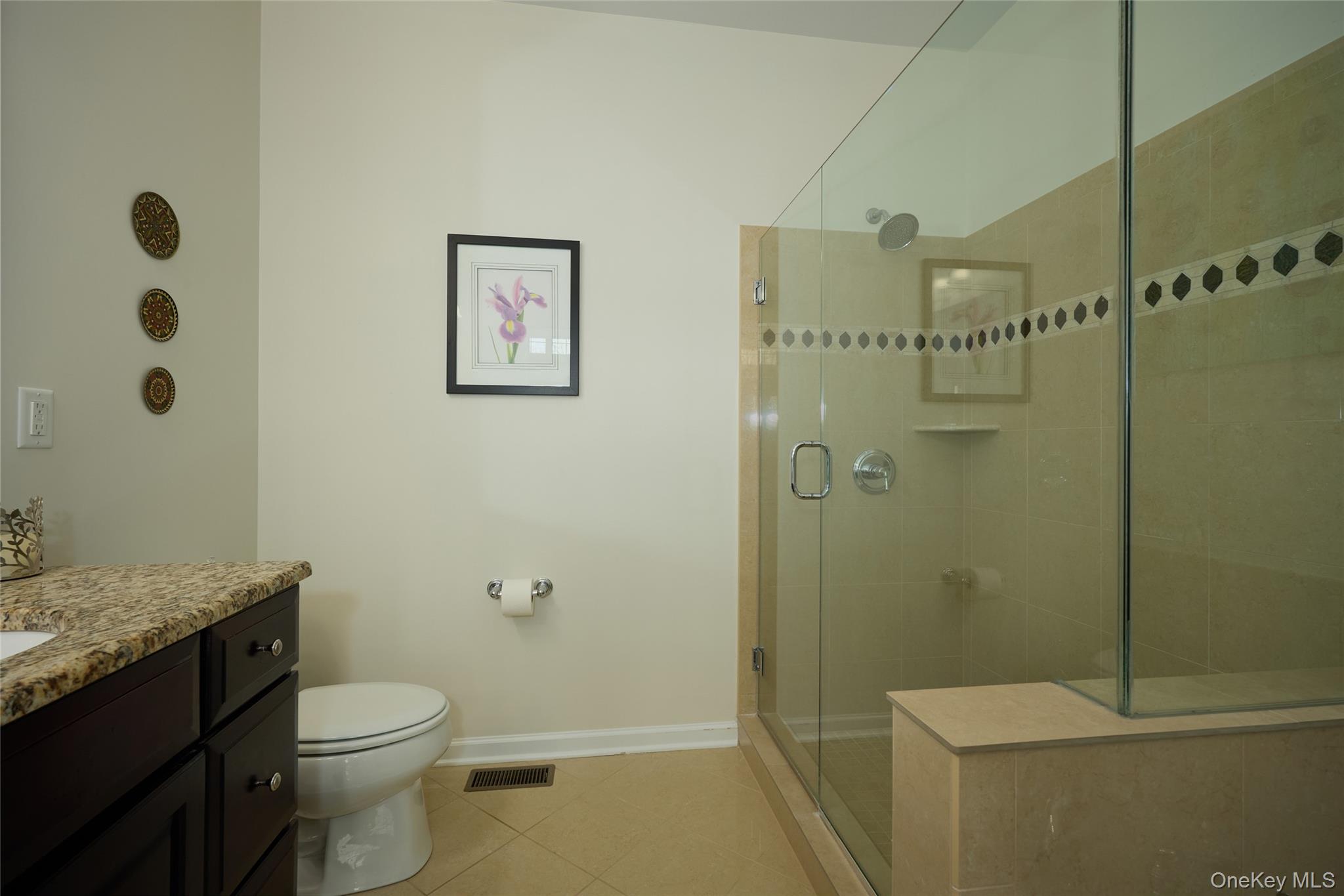 40 Evan Court Fishkill, NY 12508 - Photo 20 of 49 a bathroom with a granite countertop toilet a sink and shower