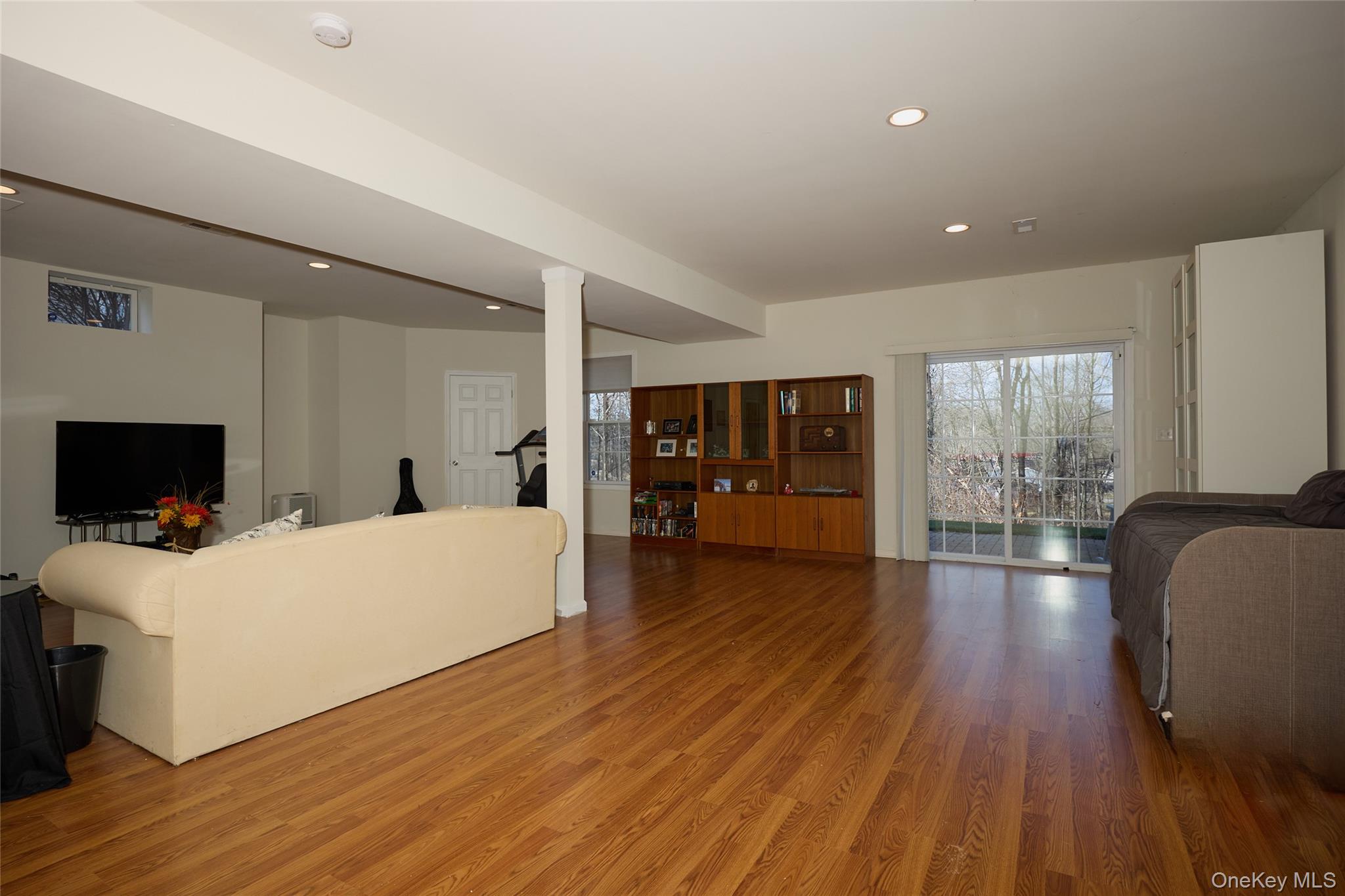 40 Evan Court Fishkill, NY 12508 - Photo 33 of 49 a living room with furniture and a flat screen tv