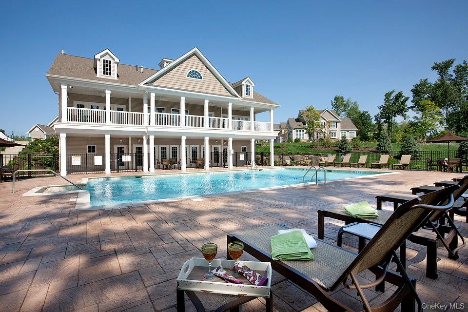 40 Evan Court Fishkill, NY 12508 - Photo 49 of 49 a front view of a house with a yard glass top table and chairs