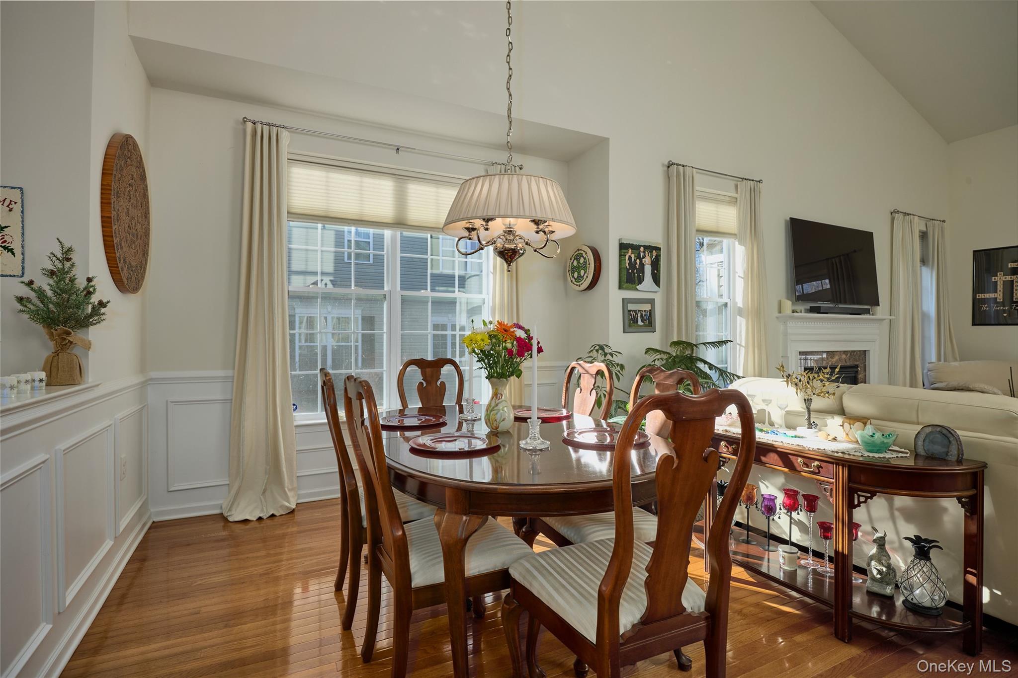40 Evan Court Fishkill, NY 12508 - Photo 8 of 49 a dining room with furniture potted plants and wooden floor
