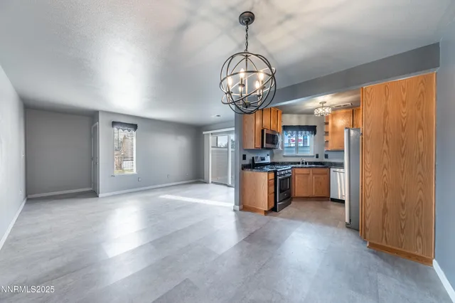 a view of a kitchen with a sink stainless steel appliances and cabinets